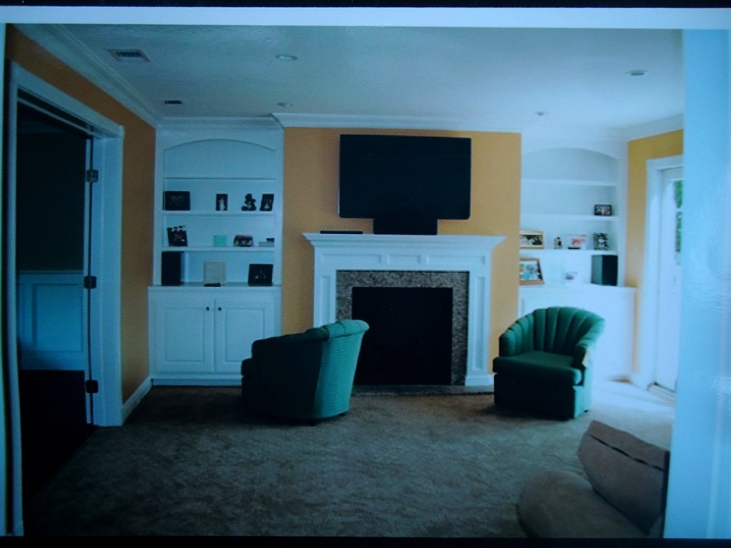 custom mantleand flanking built in cabinets