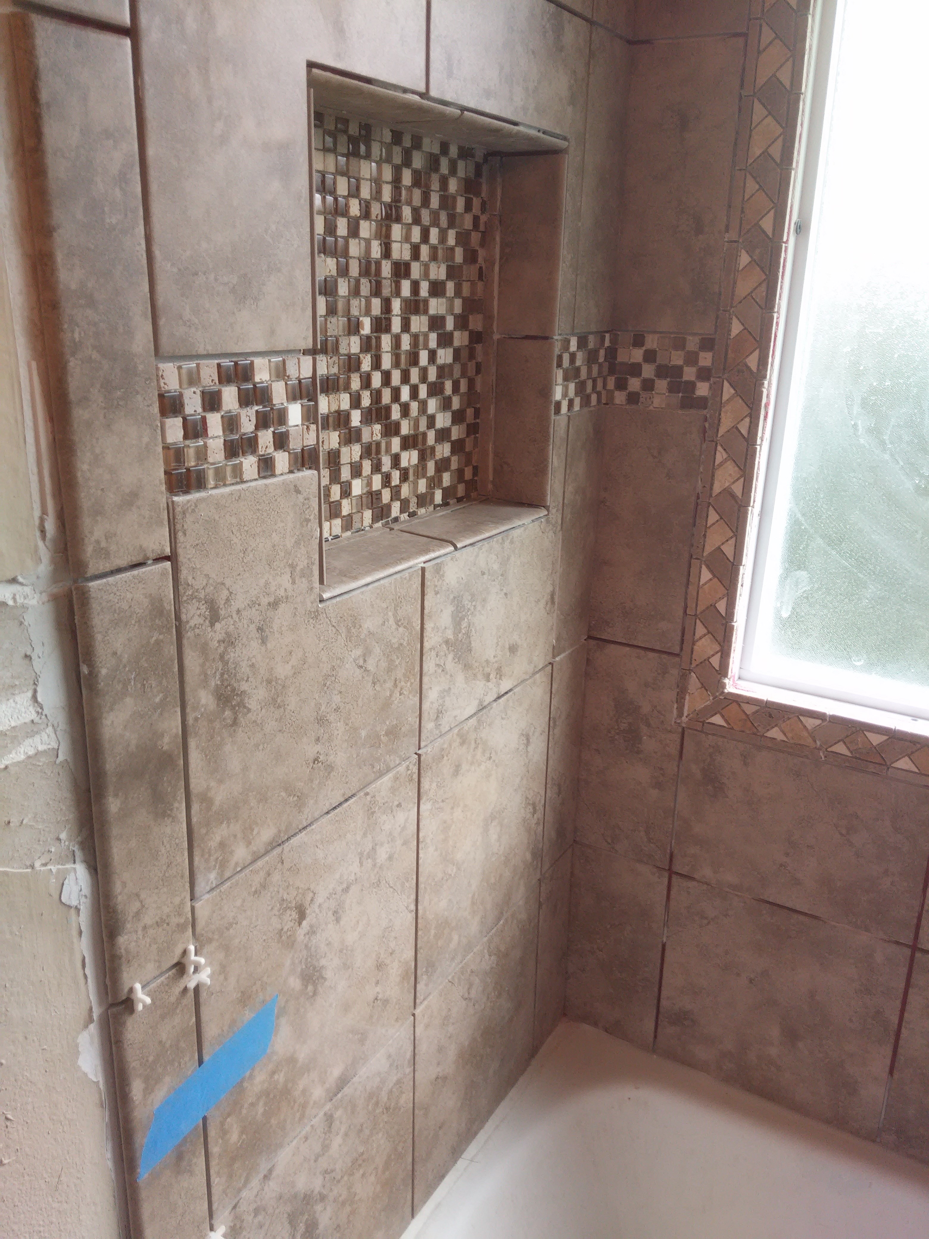 Adam's tile and bathroom remodels logo