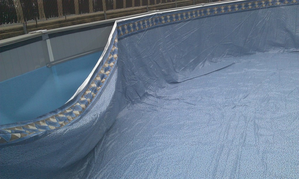 VINYL LINER BEING INSTALLED
