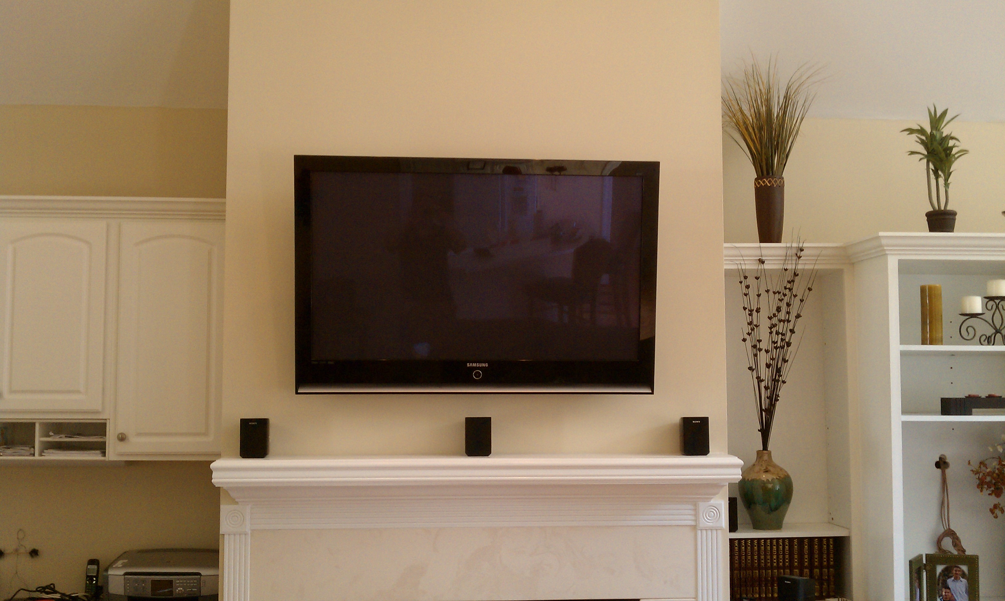flatscreen above fire place