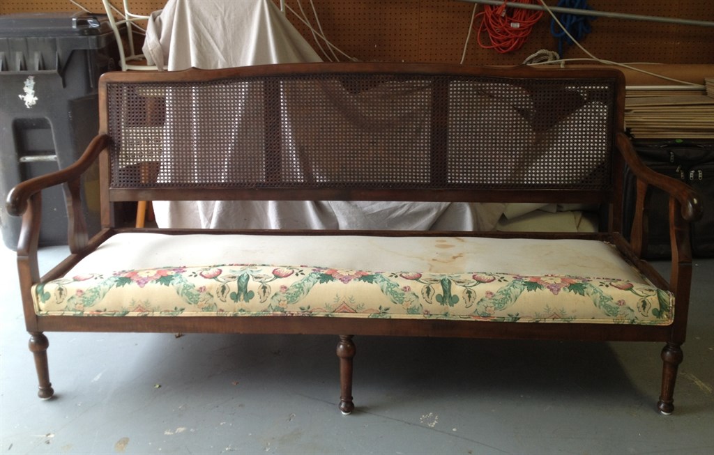 Couch with press cane back
