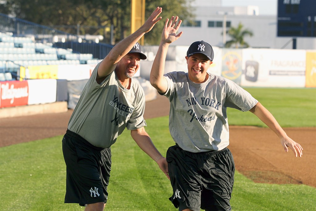 Dad congratulating son