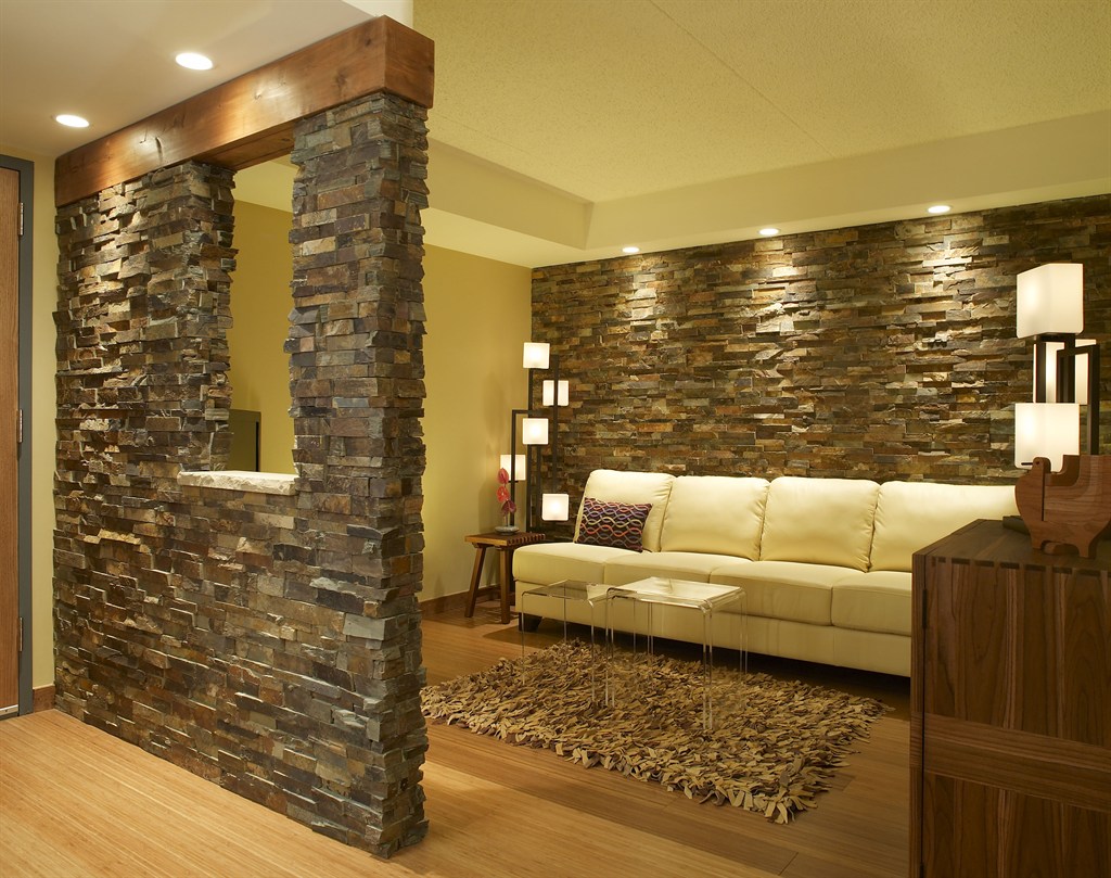 Den with stone wall
