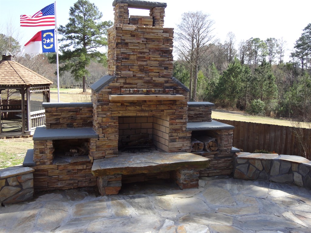 outdoor fireplace with patio