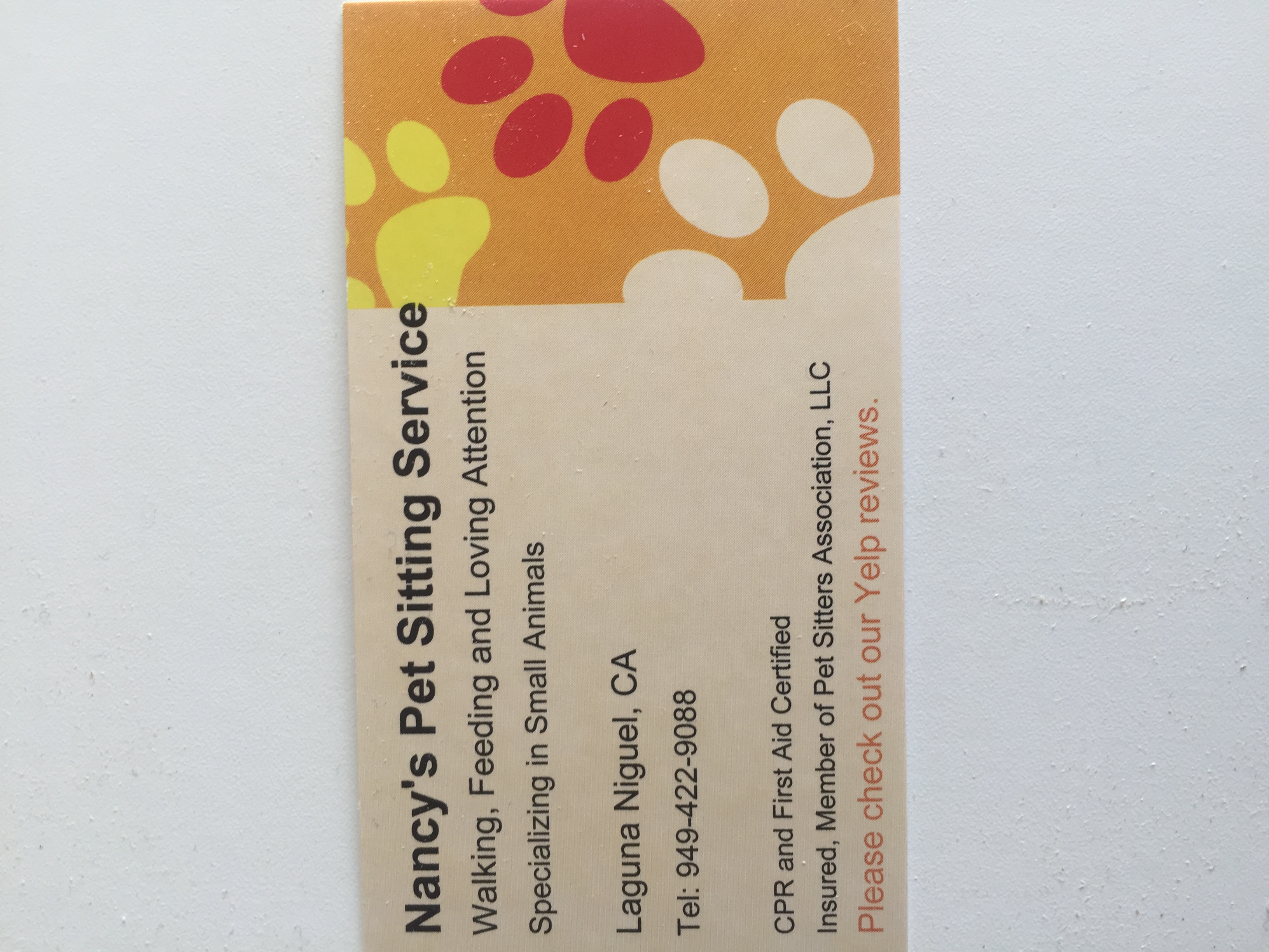 Nancy's Pet Sitting Service logo