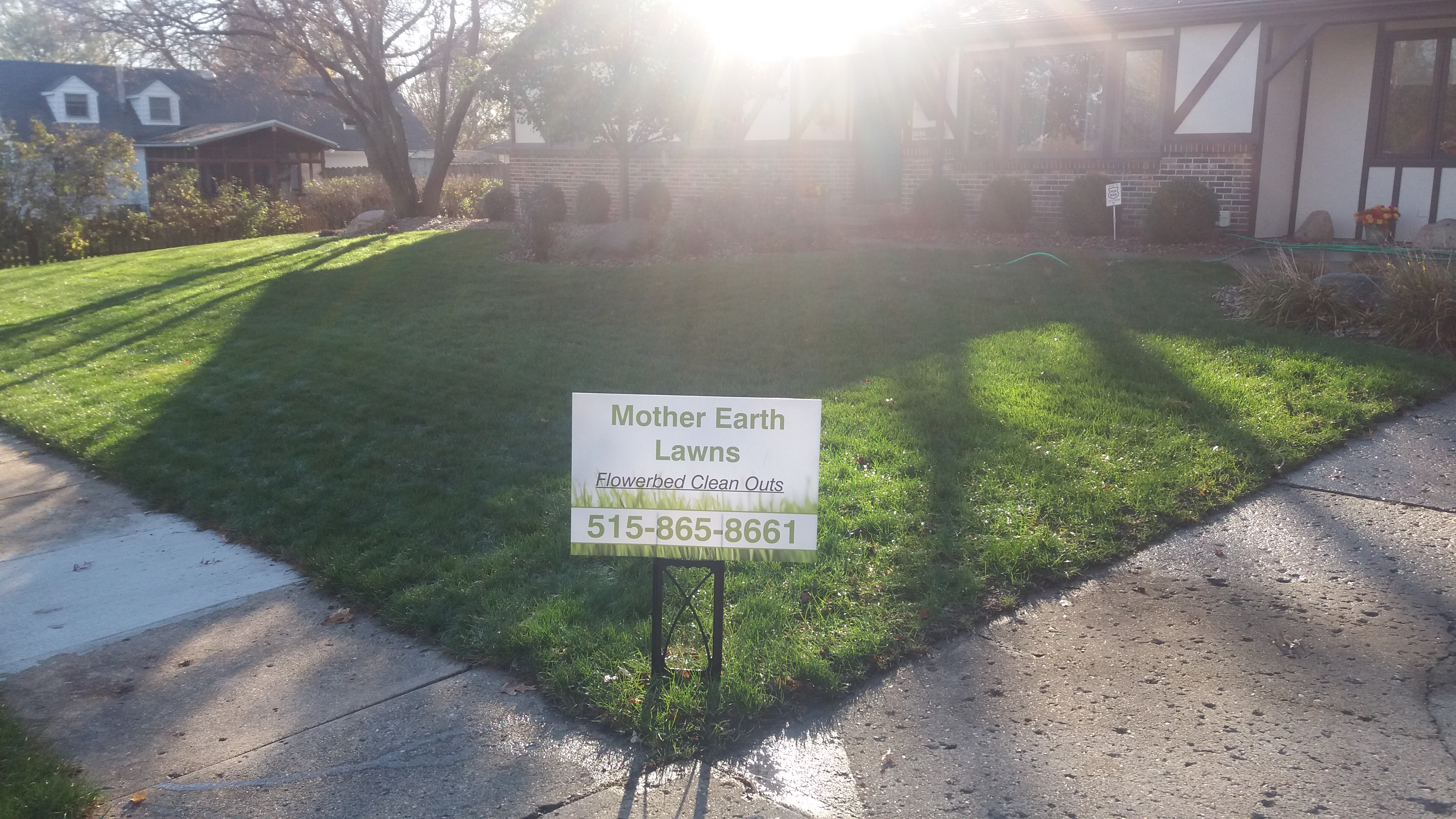 Logo for Mother Earth Lawn & Landscape